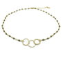 Gold necklace with three interlocking rings on a white background