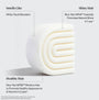 Bar of soap with text about its benefits on a light gray background