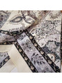 Muted grey triangle bandana scarf close-up of dark paisley and swirl print on cream fabric