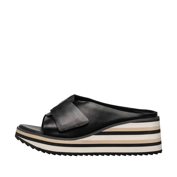 Black wedge sandal with a bow on a white background