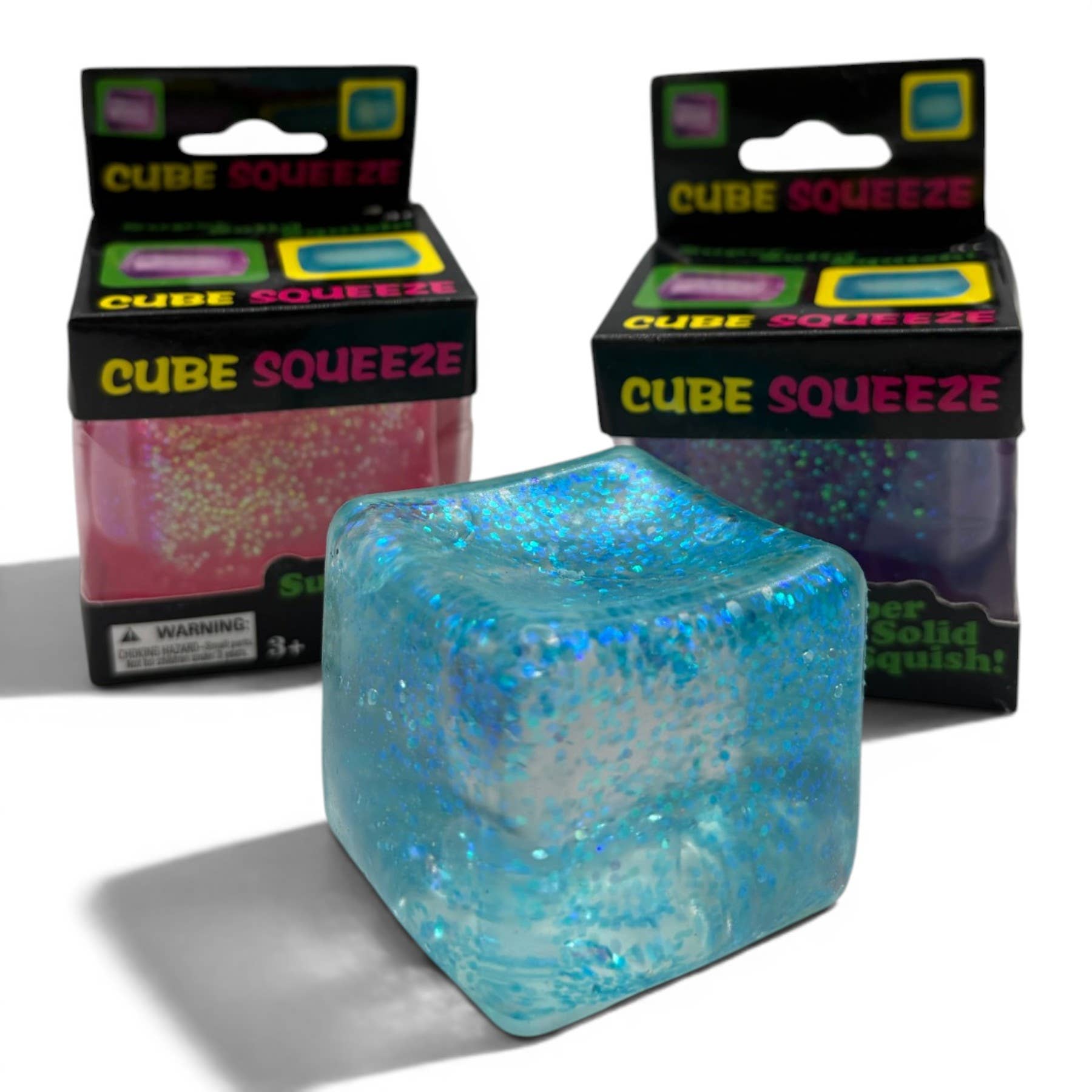Blue Cube Squeeze toy with packaging in the background