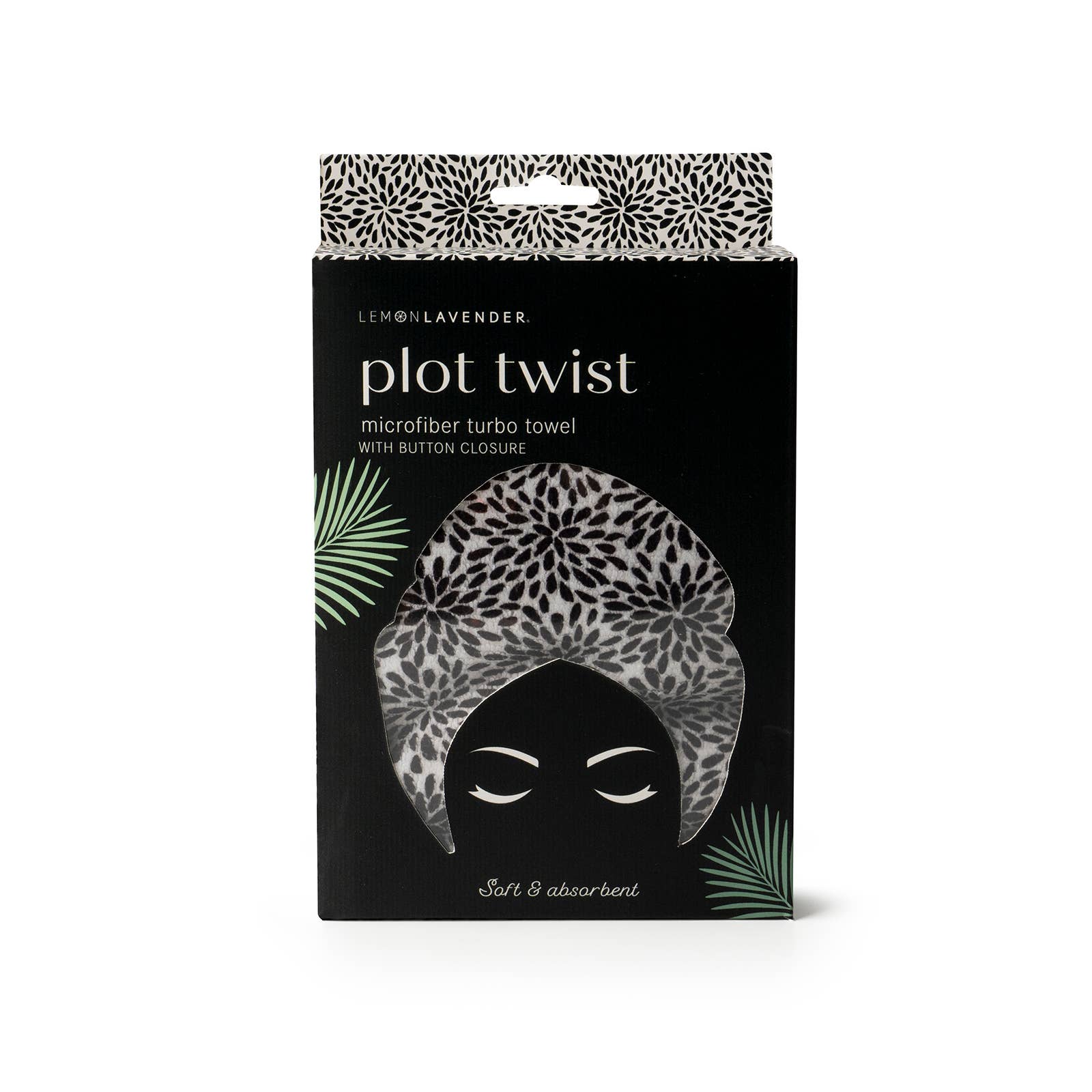 Packaging of a microfiber turban towel with floral pattern on a white background