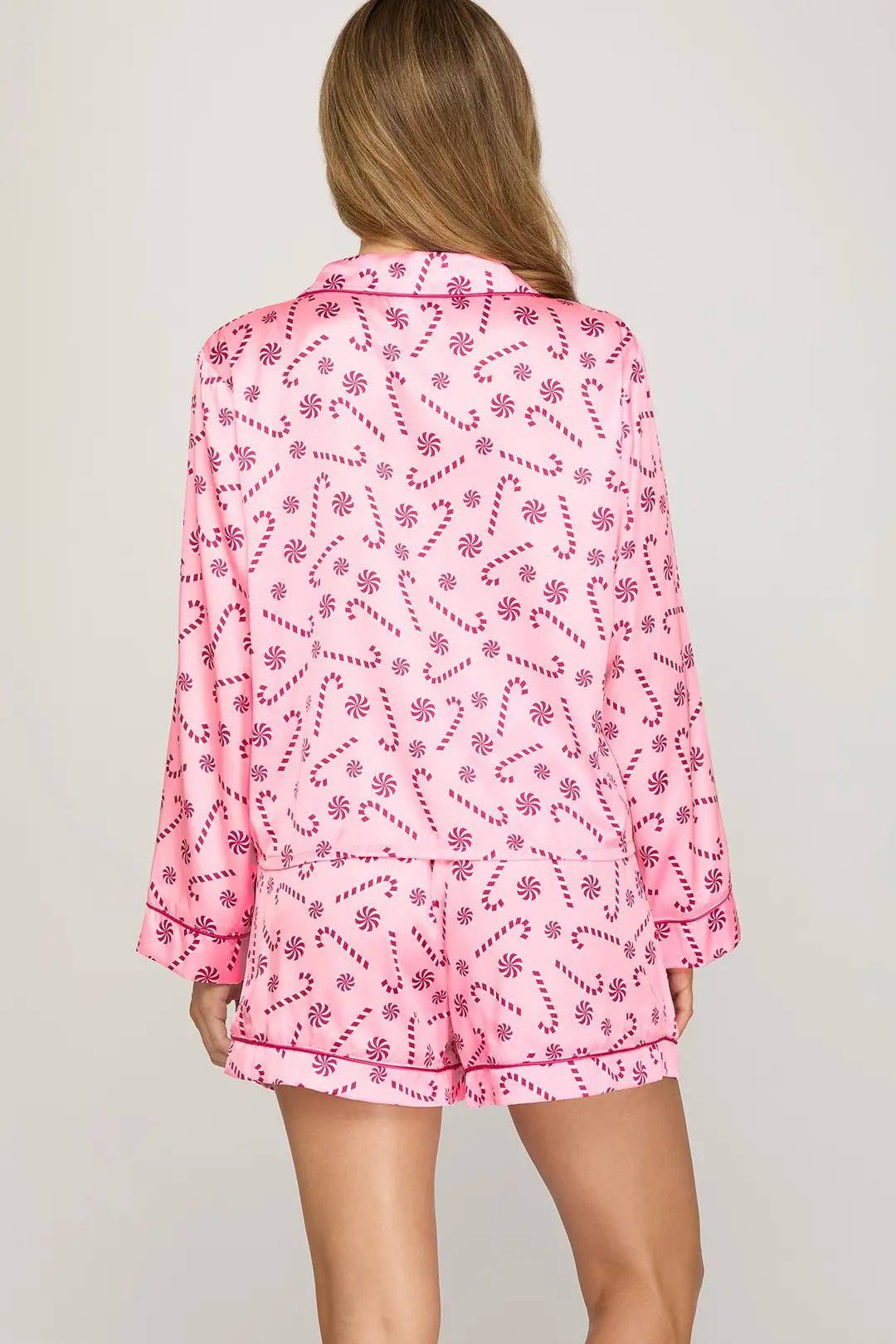 Pink pajama set with a pattern on a plain background