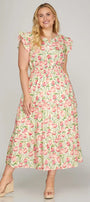Woman wearing a floral dress on a plain background