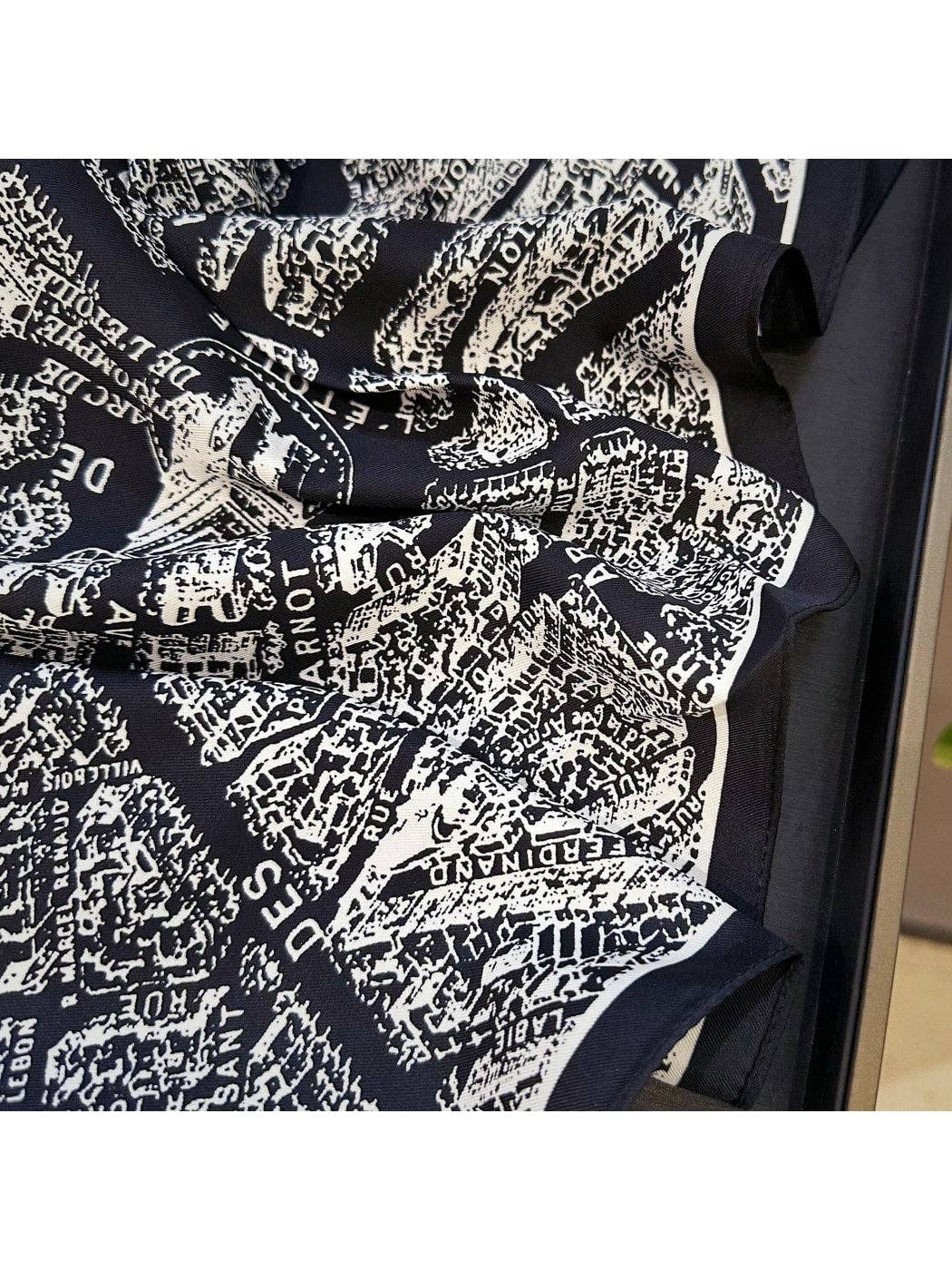 Triangle scarf close-up, black and white abstract typographic print