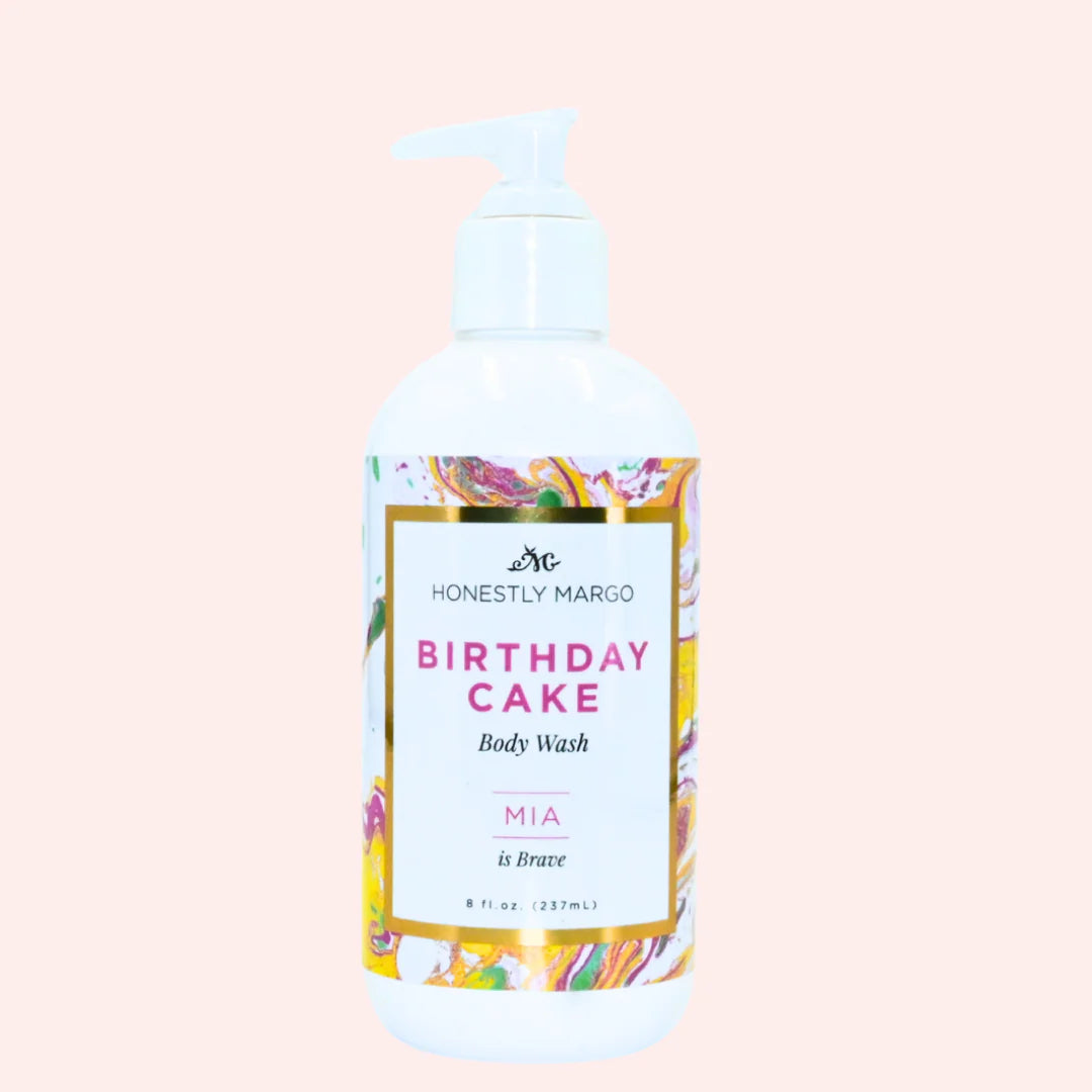 Body wash bottle labeled 'Birthday Cake' by 'Honestly Margo' on a light pink background