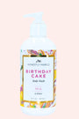 Body wash bottle labeled 'Birthday Cake' by 'Honestly Margo' on a light pink background