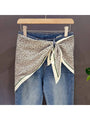 Leopard print triangle bandana with cream ends and green-trimmed borders, knot tied