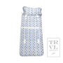 Folded fabric nap mat with blue dog pattern on a white background
