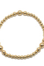 Gold beaded bracelet on a white background