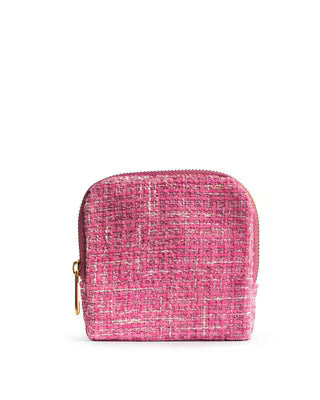 Pink textured pouch with a gold zipper on a white background