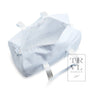 Light blue striped baby bassinet with white trim on a white background, featuring the TRVL Design logo.