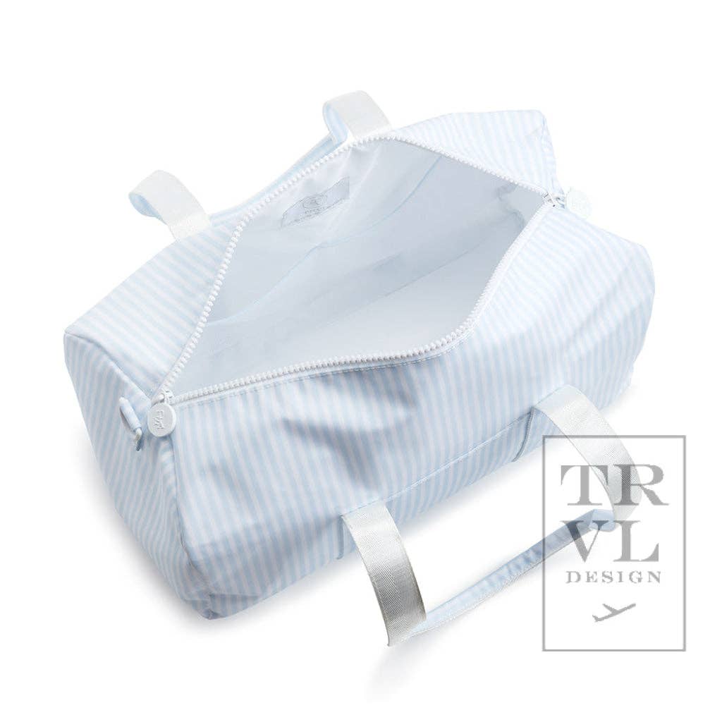Light blue striped baby bassinet with white trim on a white background, featuring the TRVL Design logo.