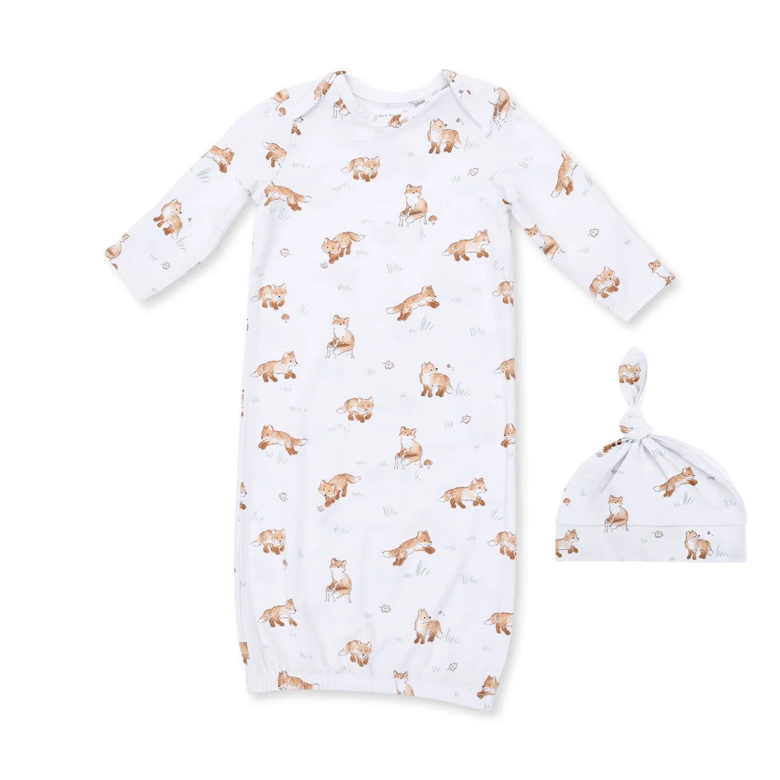 A baby sleep sack and matching knotted beanie hat set, both in white fabric with an all-over print of brown foxes and small beige leaves, displayed on a solid white background.