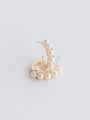 Gold earring with pearls on a light gray background
