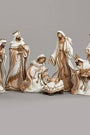 White with Gold trim 7-piece Nativity scene figurines set against a gray background