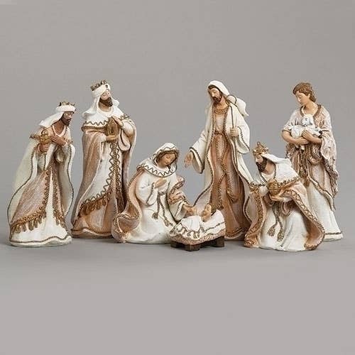 White with Gold trim 7-piece Nativity scene figurines set against a gray background