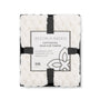 Aston Arden faux fur throw blanket with packaging on a white background