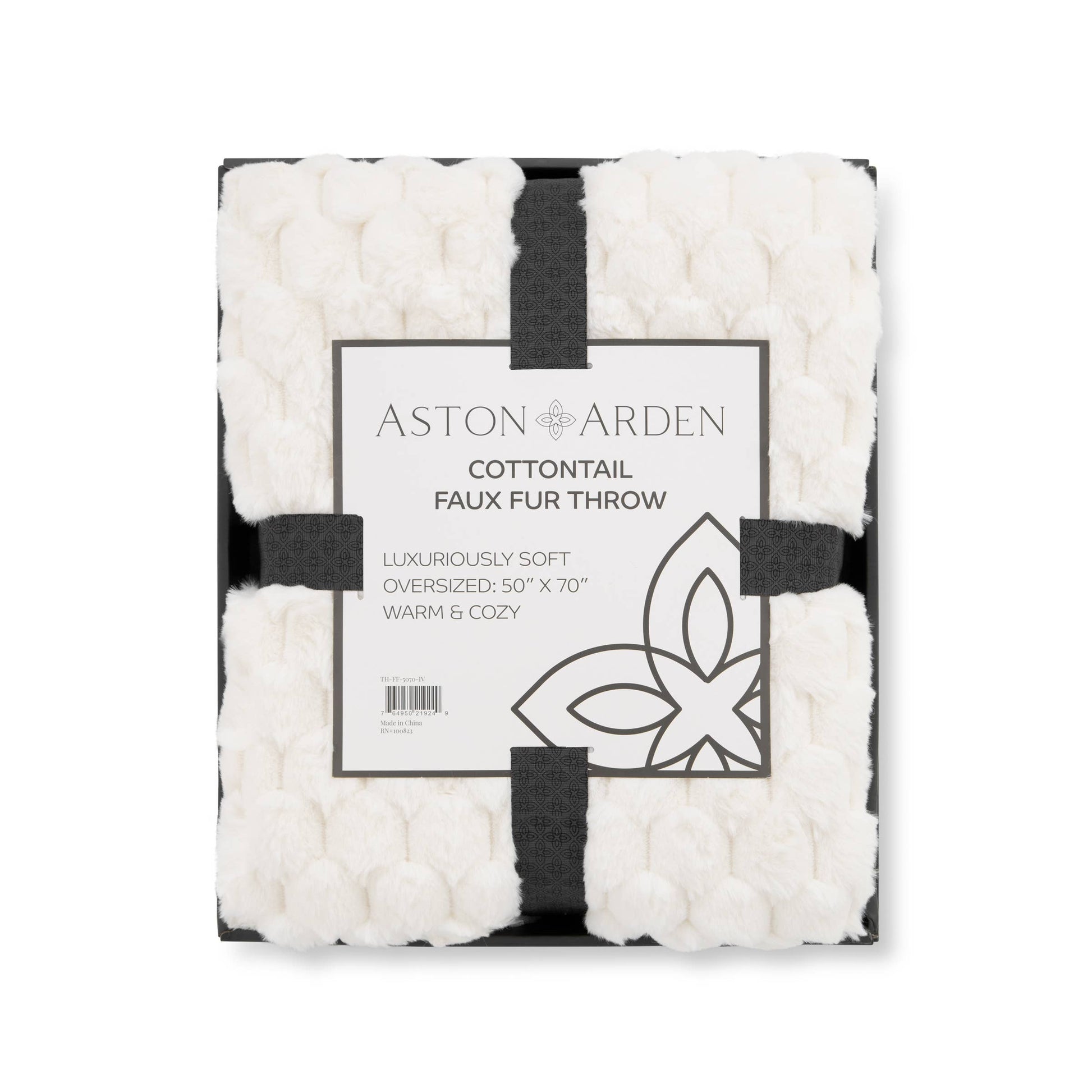 Aston Arden faux fur throw blanket with packaging on a white background