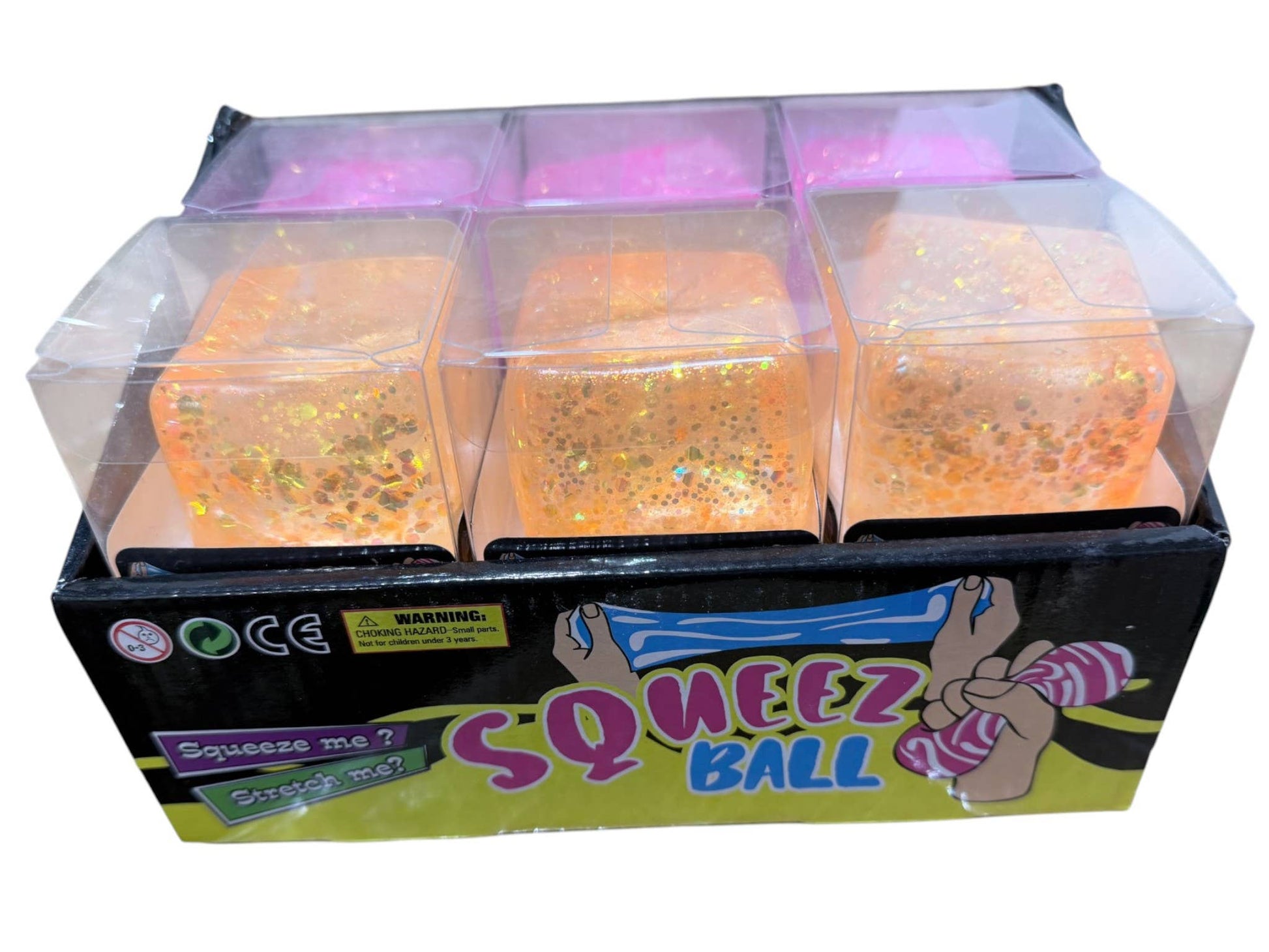 Box of Squeez Ball toys with colorful packaging on a white background