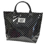 Black polka dot tote bag with 'LULU MAC' label on a white background
