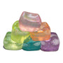 Colorful glittery ice cubes on a white background