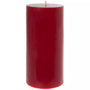 A single tall, cylindrical red pillar candle with a visible wick, centered against a plain white background.