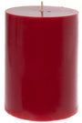 A single red pillar candle with a natural wick, photographed against a solid white background.