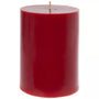 A single red pillar candle with a natural wick, photographed against a solid white background.