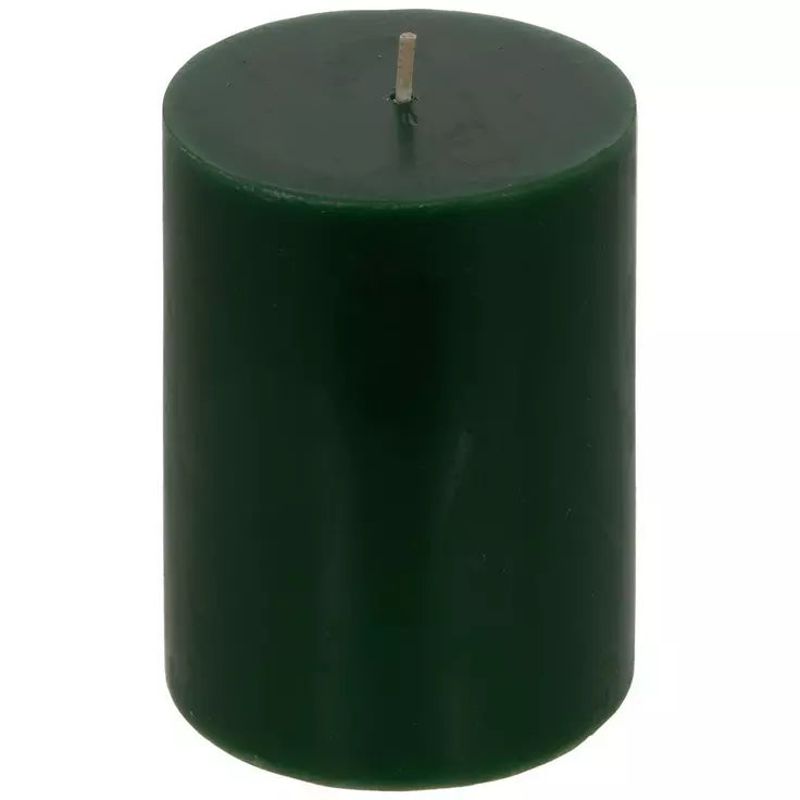 A dark green cylindrical pillar candle with a single wick, shown against a plain white background.