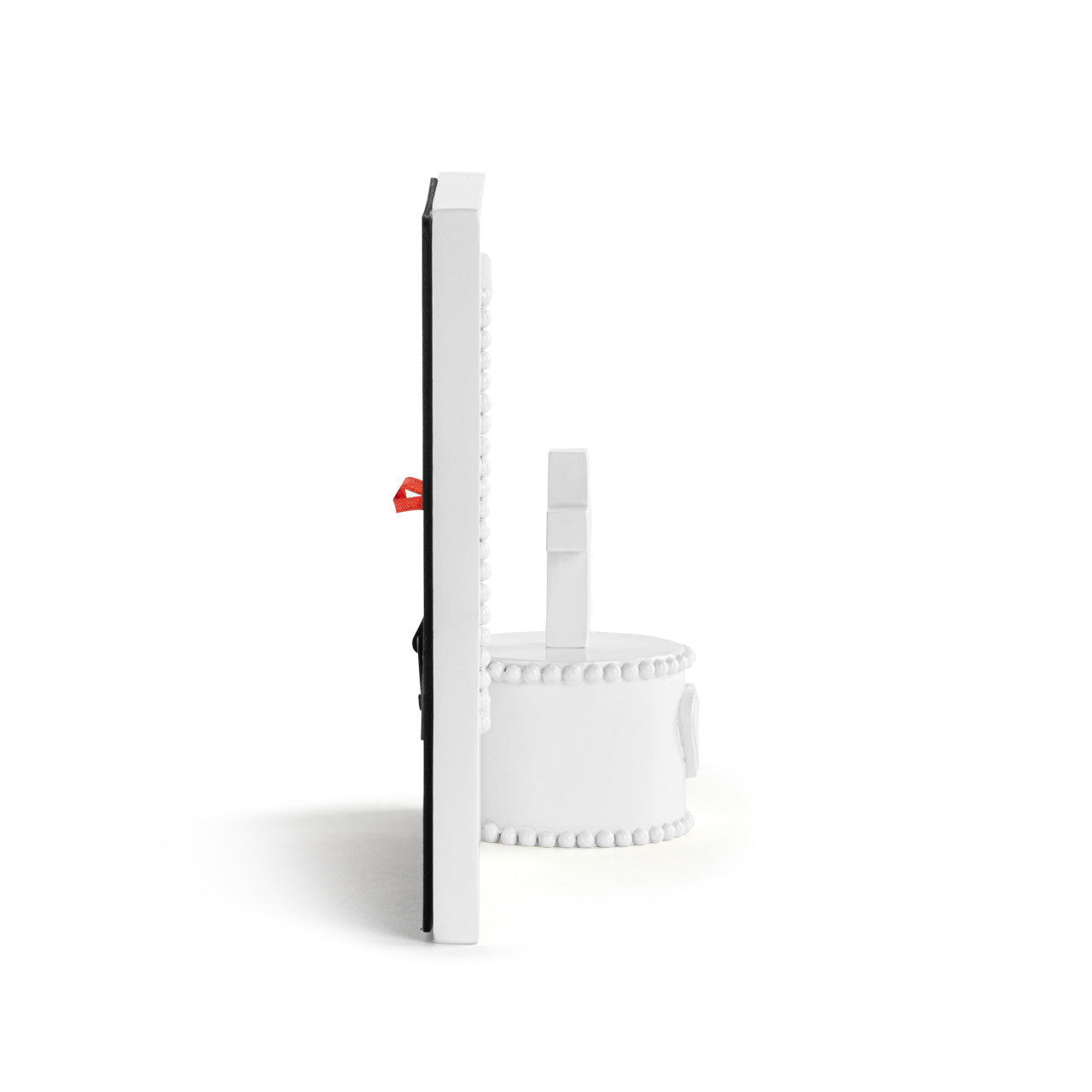 White cylindrical object with a red tag on a white background