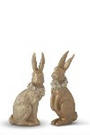 Two decorative rabbit figurines on a white background