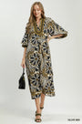 Woman wearing a patterned dress with a white background