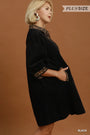 A woman modeling a black plus-size dress with leopard-print trim at the collar and cuffs, posed against a solid warm brown studio background. Text overlays read 'PLUS SIZE' and 'BLACK'.