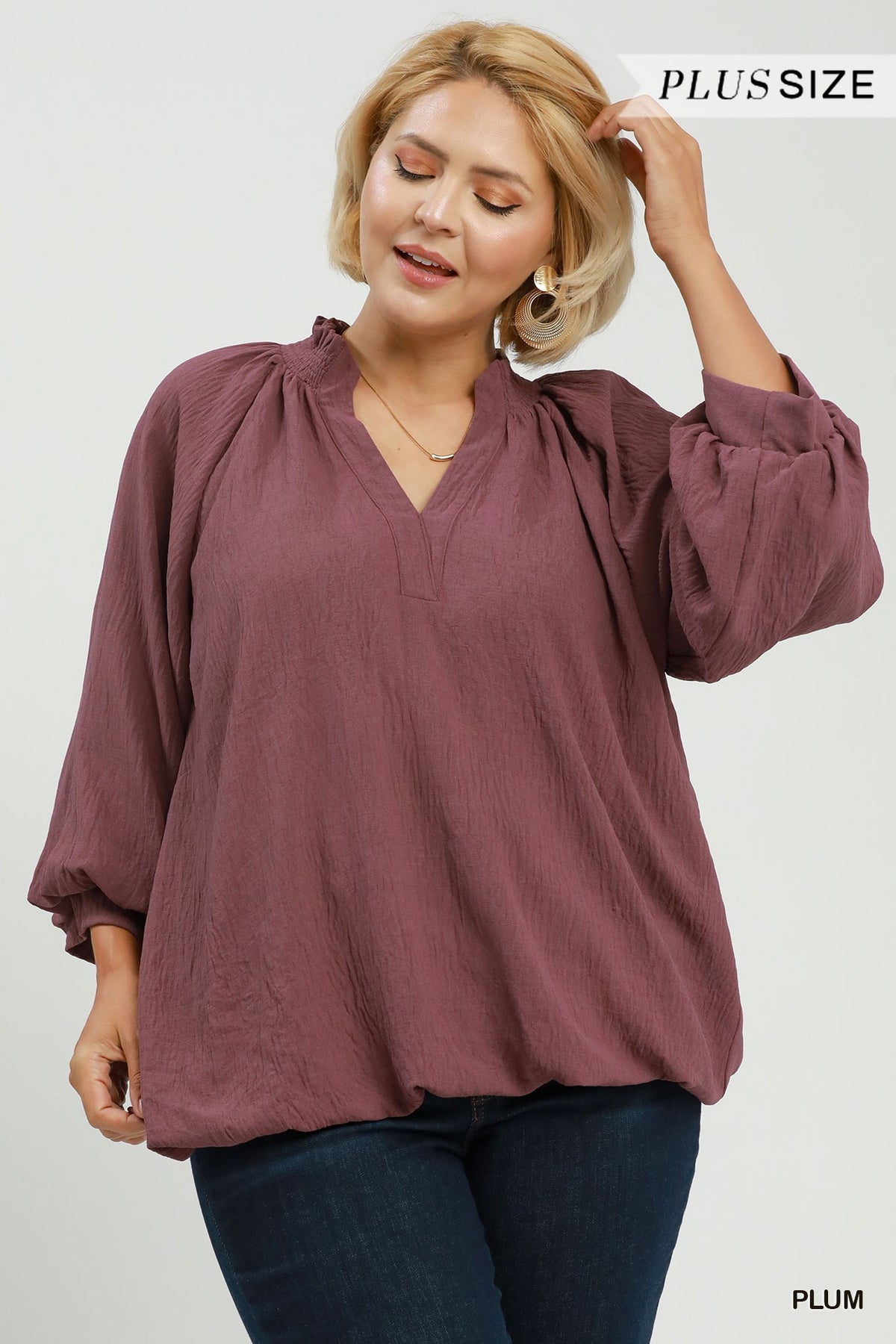 Plum v-neck smocked-collar bubble hem top with 3/4 puff sleeves