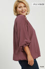 Plum bubble sleeve top with smocked collar in side view, loose gathered hem