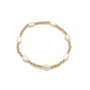Pearl bracelet with gold accents on a white background