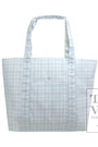 blue tote bag with grid pattern on a white background, featuring the TRVL Design logo.