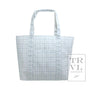 blue tote bag with grid pattern on a white background, featuring the TRVL Design logo.