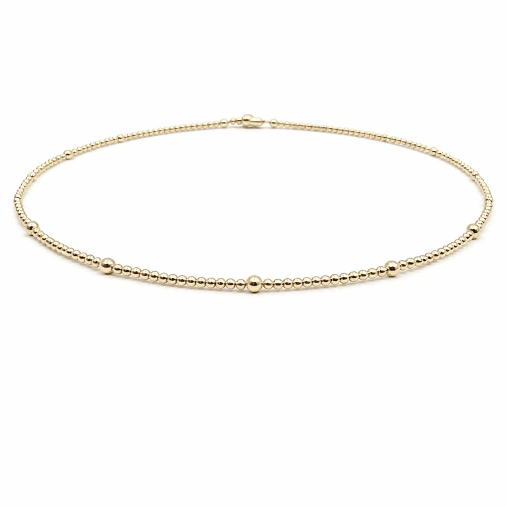 Gold necklace on a white background