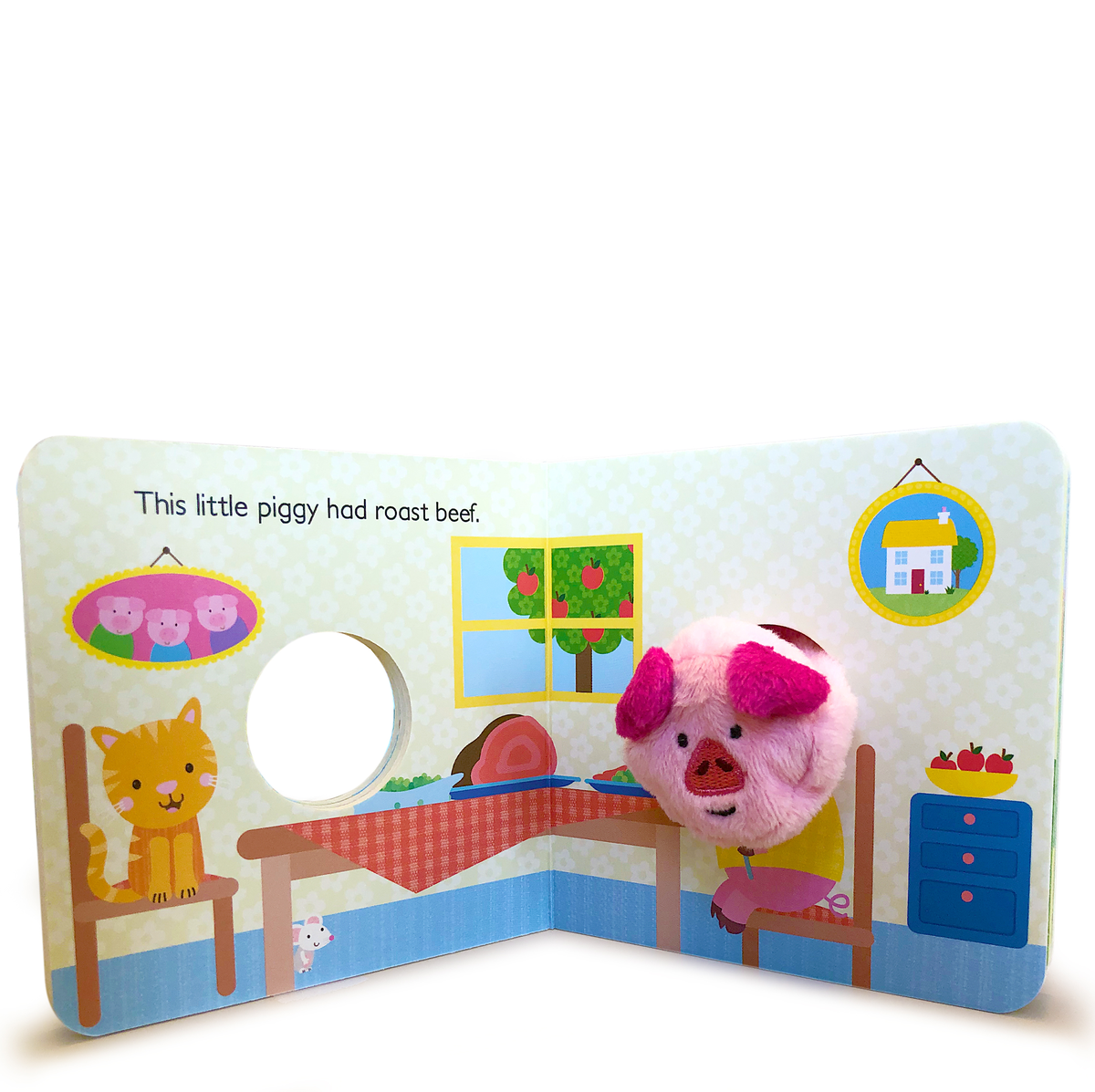Children's book with illustrations of a pig, cat, and house on a white background