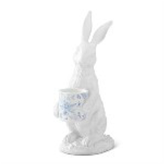 White ceramic rabbit figurine with a basket on a white background