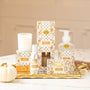 Spiced Pumpkin room spray bottle with pump, gold label, on a display table