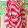 Red-and-white striped long-sleeve top with round neckline and gathered waist