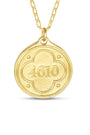 Gold pendant with engraved numbers '4610' on a white background