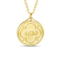 Gold pendant with engraved numbers '4610' on a white background