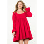 Woman wearing a red dress with long sleeves on a white background
