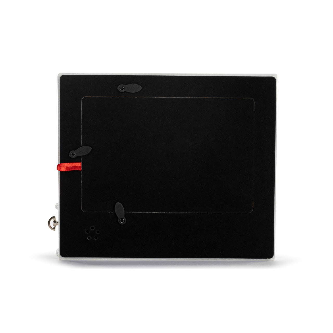 Black electronic device with a red button on a white background