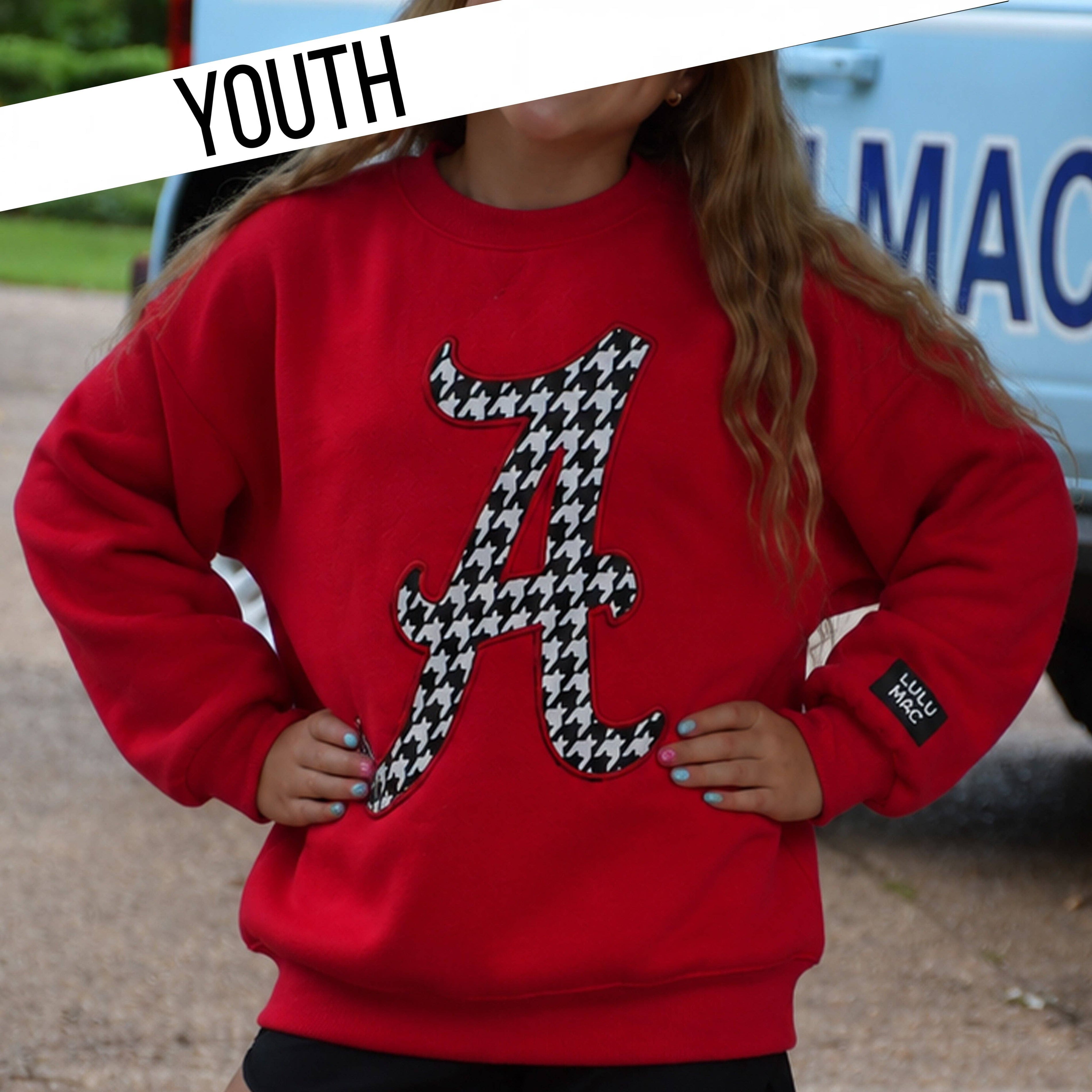 Youth crimson sweatshirt with houndstooth number 4 graphic