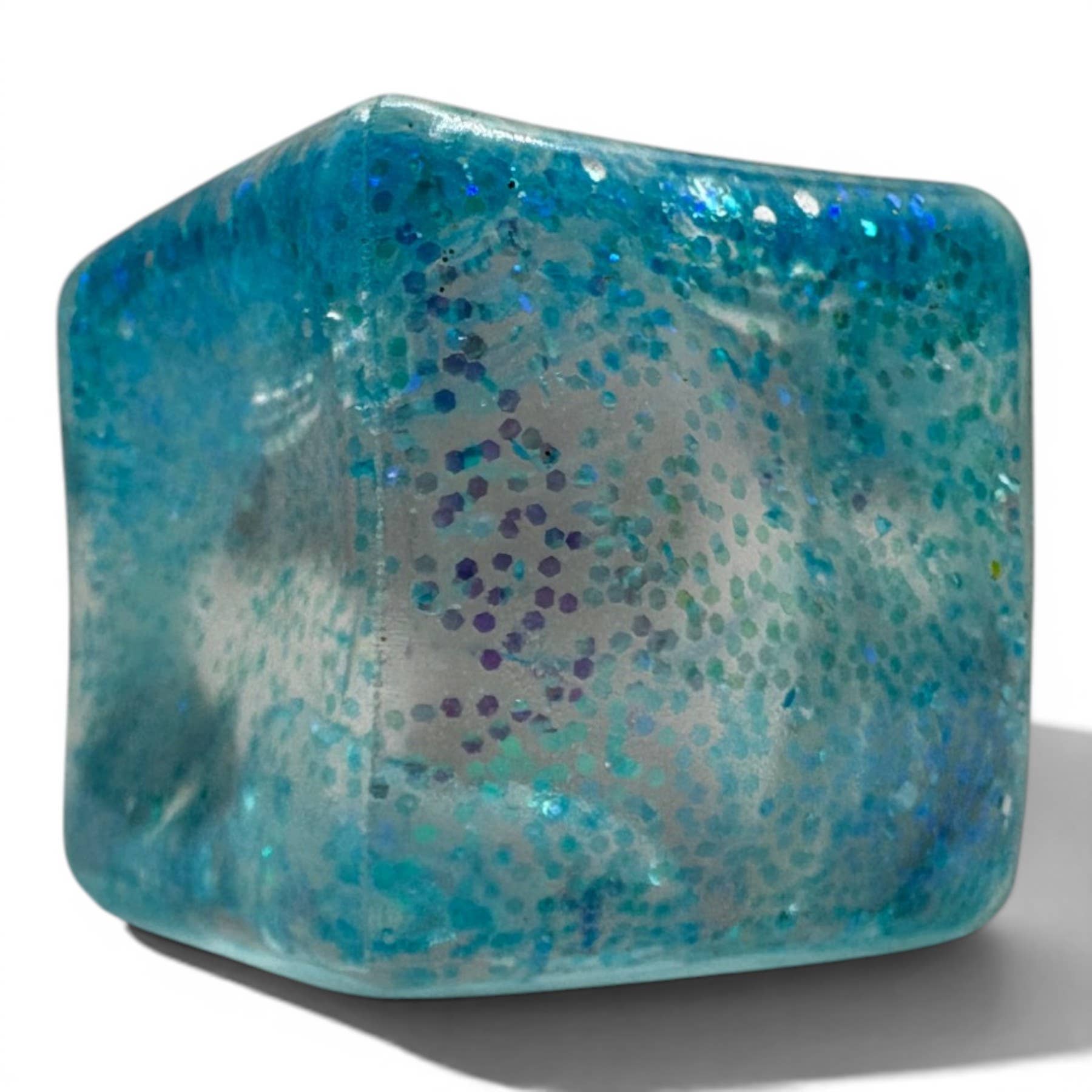 Blue textured glass object on a white background